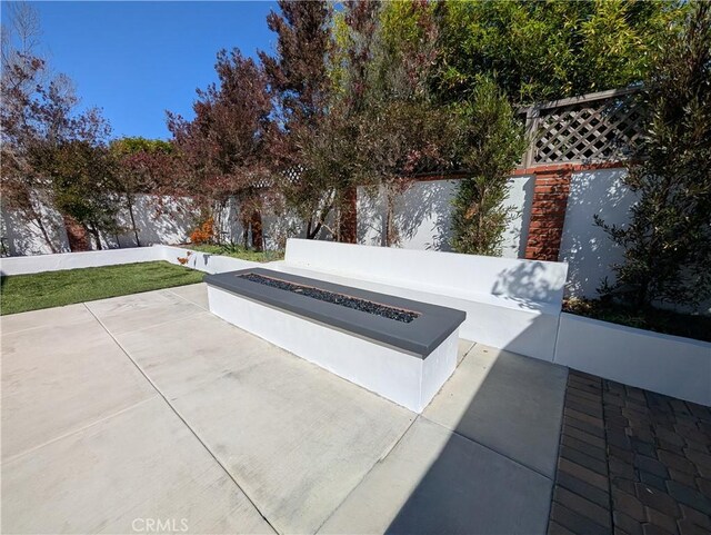 12539 Presnell St, Los Angeles, CA 90066 - view of patio / terrace with a fire pit and a fenced backyard