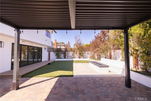 12539 Presnell St, Los Angeles, CA 90066 - view of patio with an outdoor fire pit and a fenced backyard