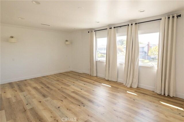 12539 Presnell St, Los Angeles, CA 90066 - unfurnished room with light wood finished floors, baseboards, and recessed lighting