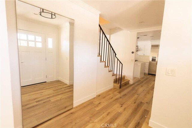 12539 Presnell St, Los Angeles, CA 90066 - foyer featuring light wood finished floors, stairs, and baseboards
