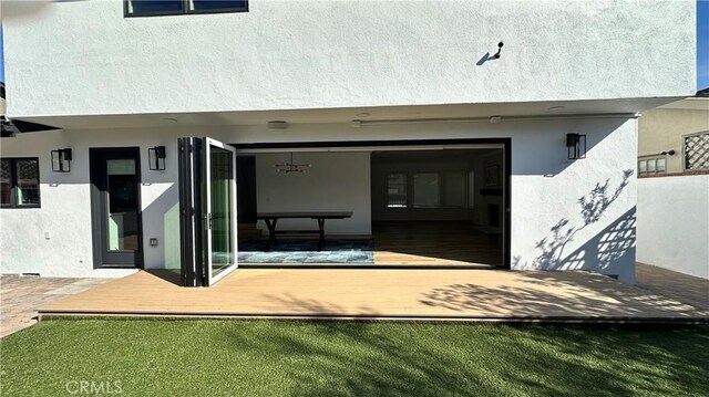 12539 Presnell St, Los Angeles, CA 90066 - rear view of house featuring stucco siding and a wooden deck