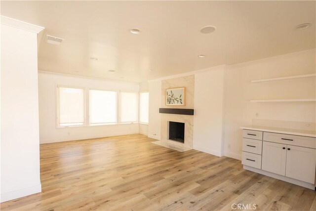 12539 Presnell St, Los Angeles, CA 90066 - unfurnished living room with light wood-style floors, a fireplace, and baseboards