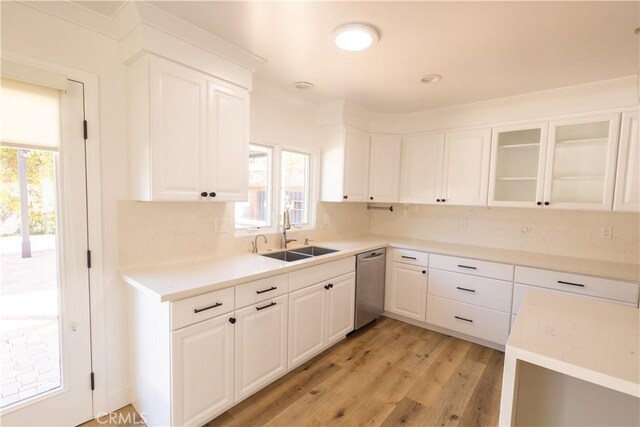 12539 Presnell St, Los Angeles, CA 90066 - kitchen featuring a sink, stainless steel dishwasher, healthy amount of natural light, and white cabinets