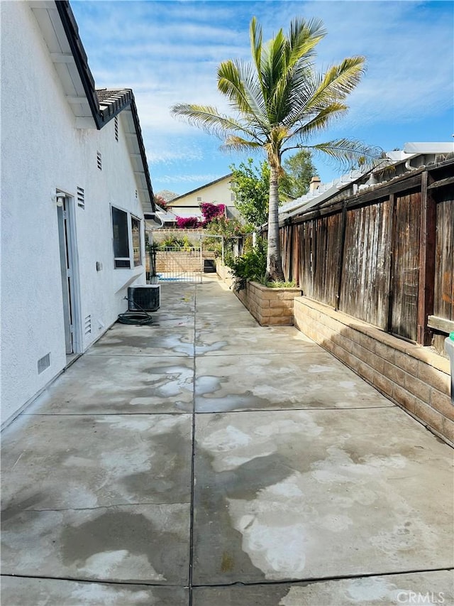 25690 Onate Dr, Moreno Valley, CA 92557 - fenced backyard with a patio area and central air condition unit