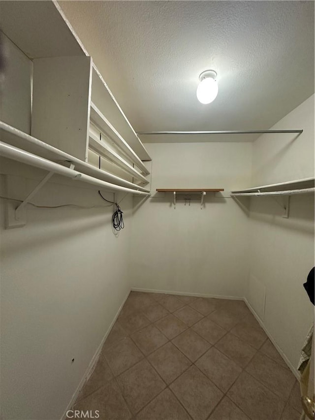 25690 Onate Dr, Moreno Valley, CA 92557 - walk in closet with tile patterned flooring