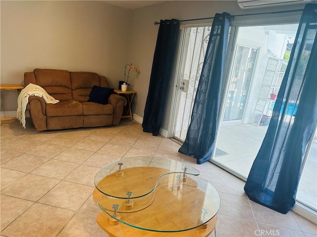 25690 Onate Dr, Moreno Valley, CA 92557 - living area with plenty of natural light, light tile patterned flooring, baseboards, and an AC wall unit
