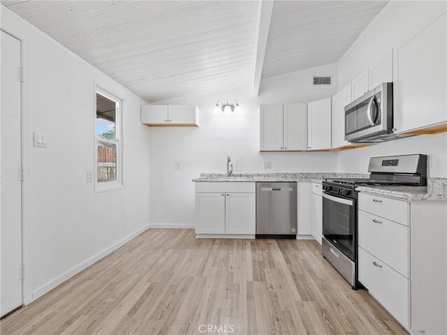 15533 Heartsease Ln, Victorville, CA 92395 - kitchen with appliances with stainless steel finishes, light wood-type flooring, a sink, white cabinetry, and baseboards