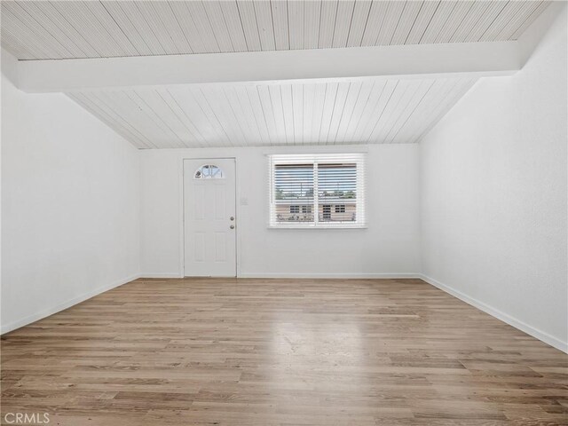 15533 Heartsease Ln, Victorville, CA 92395 - empty room with light wood-style floors, wooden ceiling, and baseboards