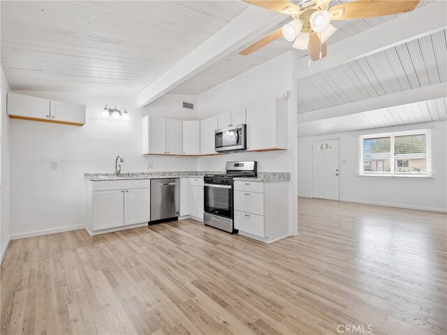 15533 Heartsease Ln, Victorville, CA 92395 - kitchen featuring appliances with stainless steel finishes, white cabinets, baseboards, ceiling fan, and light wood finished floors
