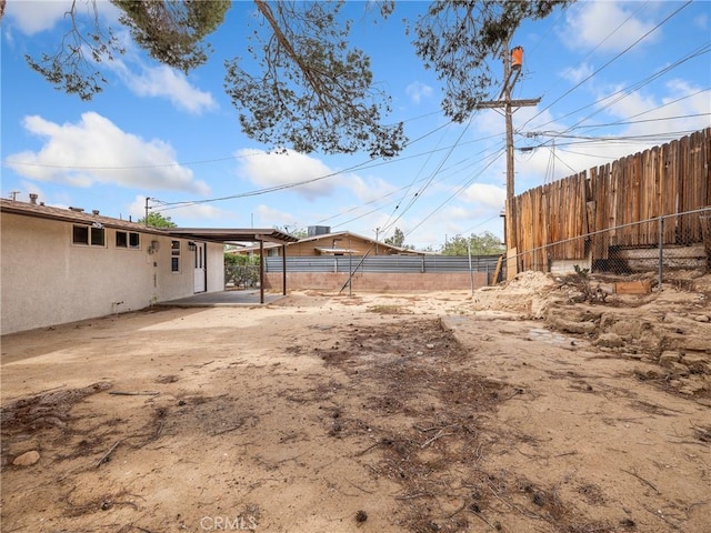 15533 Heartsease Ln, Victorville, CA 92395 - view of yard with fence and an attached carport