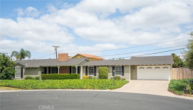 14691 Leon Pl, Tustin, CA 92780 - single story home featuring an attached garage, driveway, fence, and a chimney