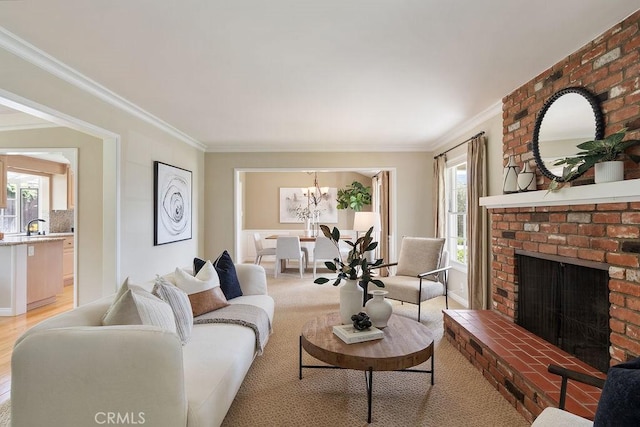 14691 Leon Pl, Tustin, CA 92780 - living area with healthy amount of natural light, ornamental molding, a chandelier, and a fireplace