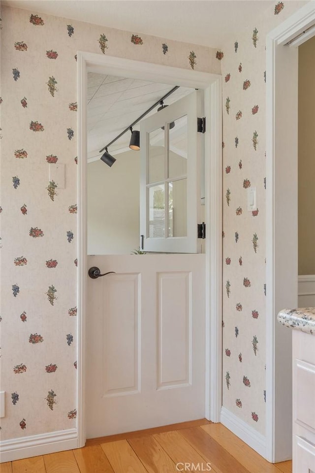 14691 Leon Pl, Tustin, CA 92780 - entryway with wallpapered walls, baseboards, and light wood-style floors