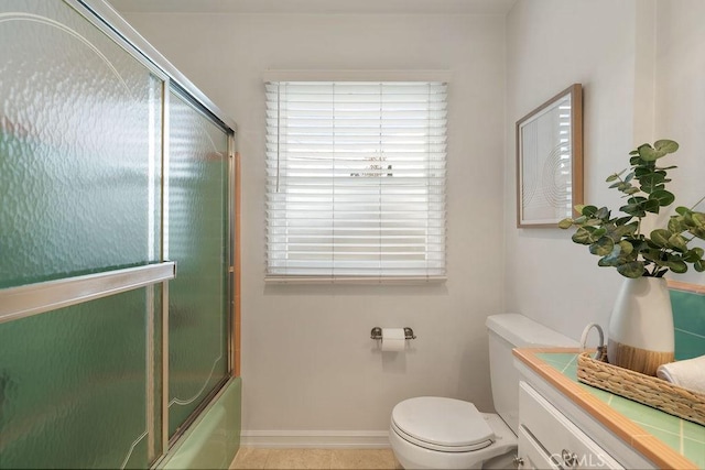 14691 Leon Pl, Tustin, CA 92780 - full bath featuring toilet, combined bath / shower with glass door, and baseboards