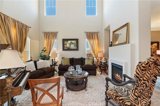 16418 Village Meadow Dr, Riverside, CA 92503 - living area featuring a towering ceiling, plenty of natural light, and a glass covered fireplace