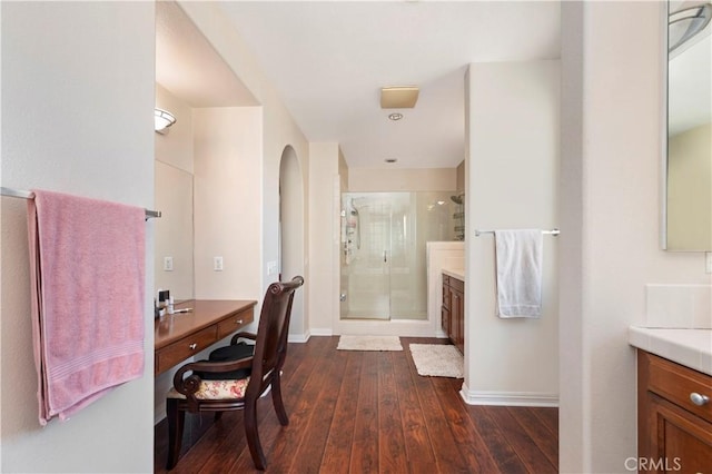16418 Village Meadow Dr, Riverside, CA 92503 - full bath with vanity, a stall shower, hardwood / wood-style floors, and baseboards