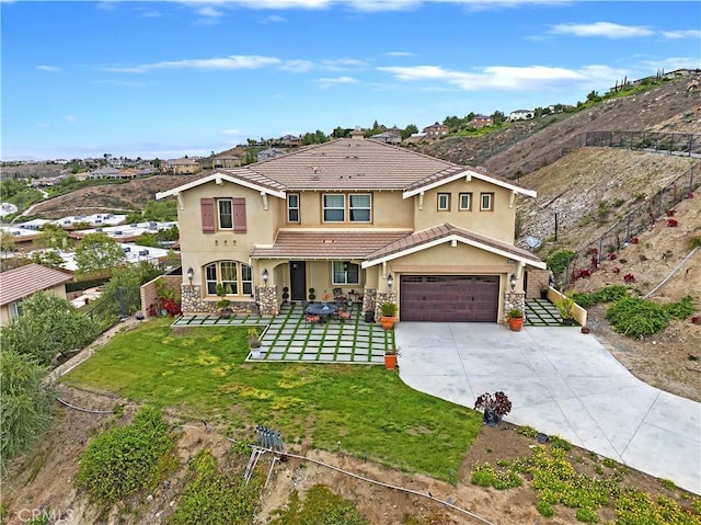 16418 Village Meadow Dr, Riverside, CA 92503 - view of front of house featuring stucco siding, a tile roof, driveway, a garage, and stone siding