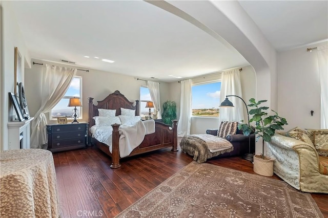 16418 Village Meadow Dr, Riverside, CA 92503 - bedroom featuring dark wood-style floors and arched walkways