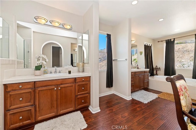 16418 Village Meadow Dr, Riverside, CA 92503 - full bath with hardwood / wood-style flooring, vanity, a garden tub, recessed lighting, and a shower
