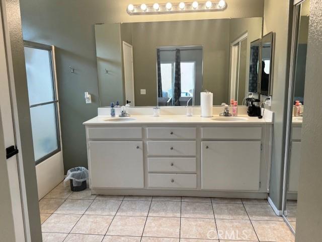 1421 Alta Palma Rd, Perris, CA 92571 - bathroom with tile patterned floors and double vanity