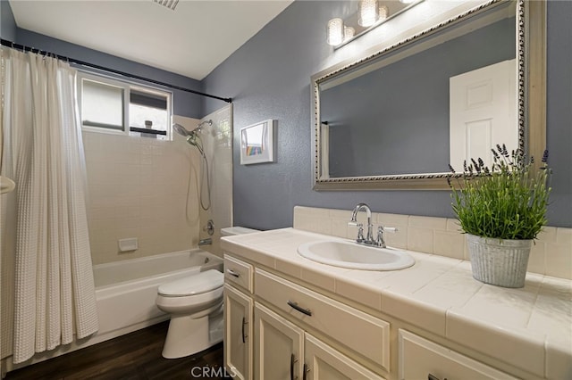 3171 Eagle Lake Ct, Chico, CA 95973 - full bathroom with toilet, shower / bathtub combination with curtain, vanity, and wood finished floors