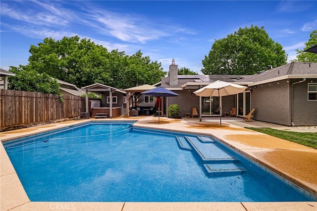 3171 Eagle Lake Ct, Chico, CA 95973 - view of swimming pool with a hot tub, a fenced backyard, a patio area, and a gazebo