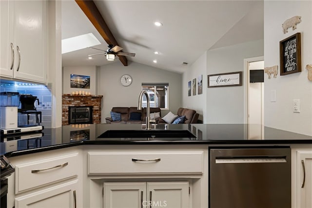 3171 Eagle Lake Ct, Chico, CA 95973 - kitchen with stainless steel dishwasher, a sink, open floor plan, and dark countertops
