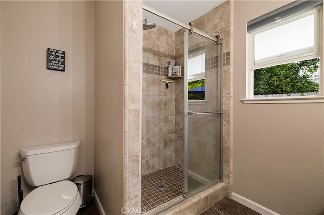 3171 Eagle Lake Ct, Chico, CA 95973 - full bathroom with a stall shower, baseboards, toilet, and tile patterned floors