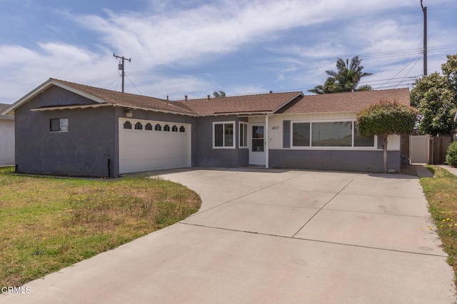 4117 S C St, Oxnard, CA 93033 - single story home featuring concrete driveway, an attached garage, and stucco siding