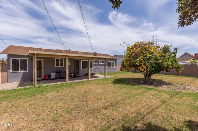 4117 S C St, Oxnard, CA 93033 - rear view of house with a fenced backyard, a patio, and stucco siding