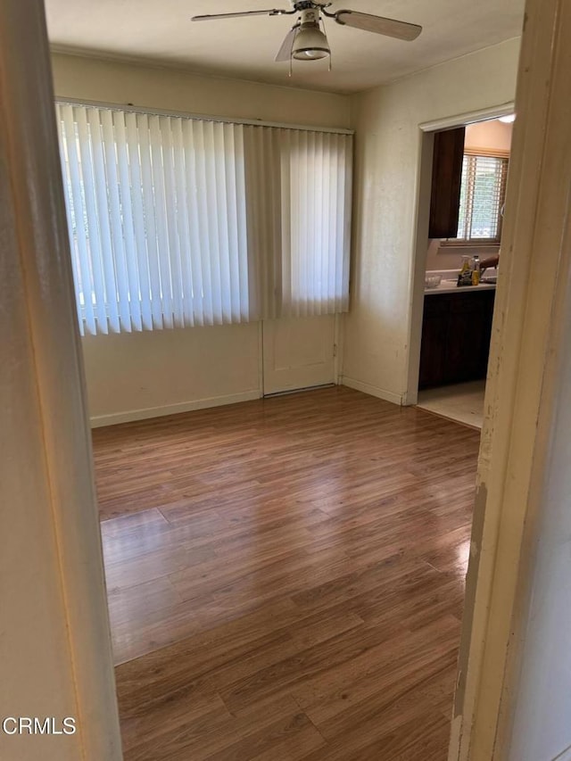4117 S C St, Oxnard, CA 93033 - empty room with ceiling fan and wood finished floors