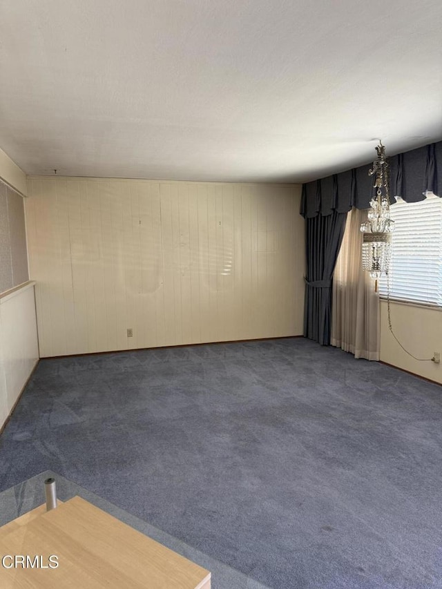 4117 S C St, Oxnard, CA 93033 - spare room featuring carpet flooring and wooden walls