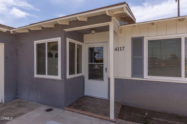 4117 S C St, Oxnard, CA 93033 - doorway to property featuring stucco siding and a patio