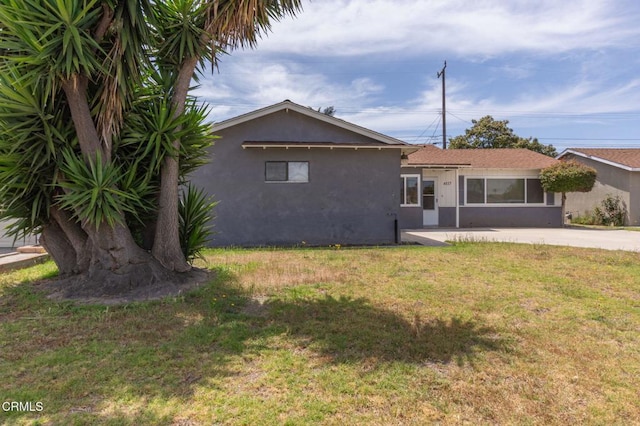 4117 S C St, Oxnard, CA 93033 - back of property with stucco siding and a lawn