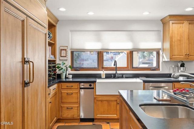 10971 Alto Ct, Oak View, CA 93022 - kitchen featuring a sink, dark countertops, brown cabinets, and recessed lighting