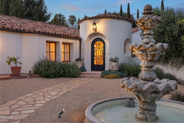 10971 Alto Ct, Oak View, CA 93022 - exterior entry at dusk featuring stucco siding and a tile roof