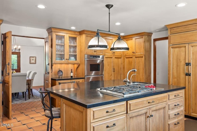 10971 Alto Ct, Oak View, CA 93022 - kitchen featuring stainless steel appliances, dark countertops, recessed lighting, a kitchen island with sink, and a chandelier