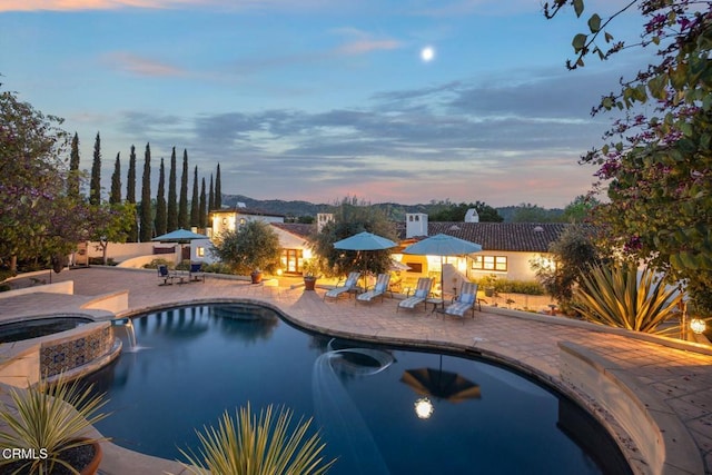 10971 Alto Ct, Oak View, CA 93022 - pool at dusk featuring a patio and a pool with connected hot tub