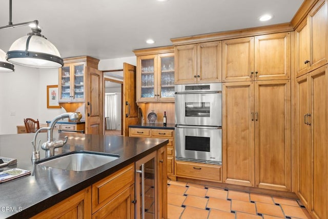 10971 Alto Ct, Oak View, CA 93022 - kitchen with double oven, a sink, dark countertops, beverage cooler, and recessed lighting