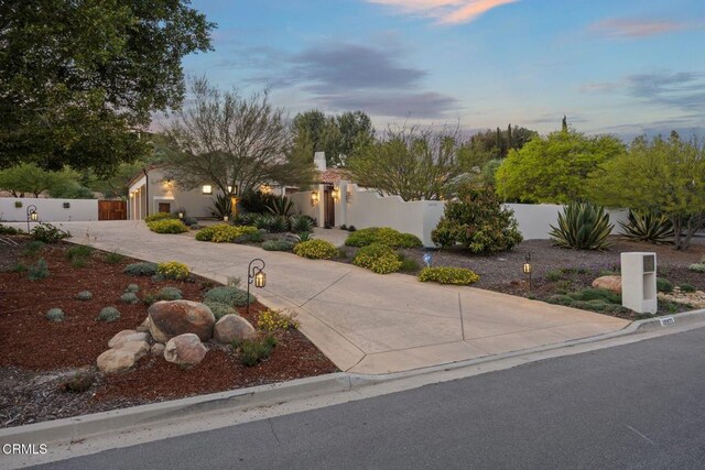 10971 Alto Ct, Oak View, CA 93022 - view of front of property with a fenced front yard and curved driveway
