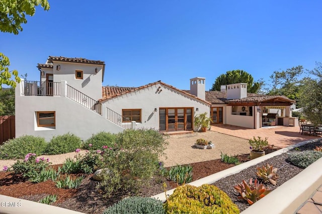 10971 Alto Ct, Oak View, CA 93022 - back of house with french doors, stucco siding, a chimney, and a patio area