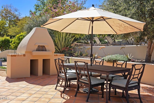10971 Alto Ct, Oak View, CA 93022 - view of patio with a fireplace, outdoor dining area, and fence