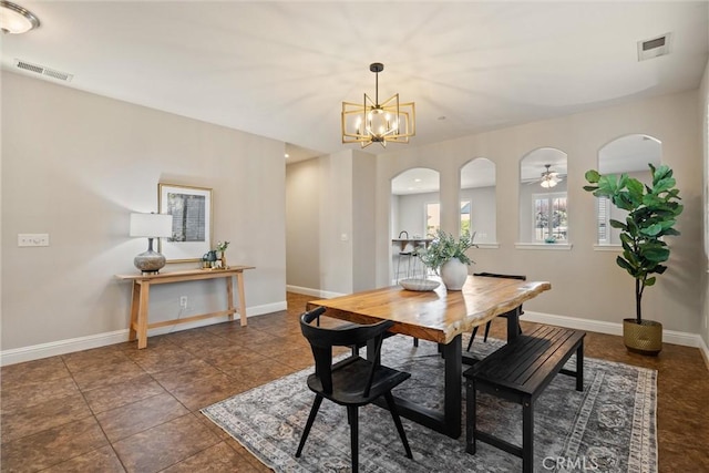 7 Abbott Cir, Chico, CA 95973 - dining area featuring arched walkways, a chandelier, and baseboards