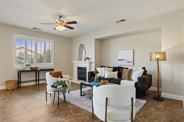 7 Abbott Cir, Chico, CA 95973 - living area with a ceiling fan, tile patterned flooring, a glass covered fireplace, and baseboards
