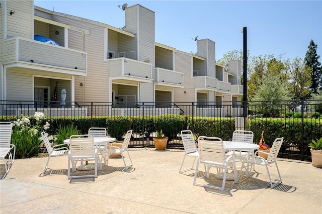 777 S Citrus Ave Unit 266, Azusa, CA 91702 - view of patio featuring outdoor dining area and fence
