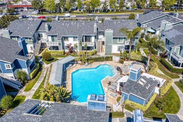 aerial view of residential area featuring a pool area