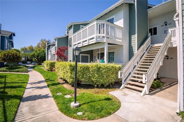 view of property's community featuring stairs