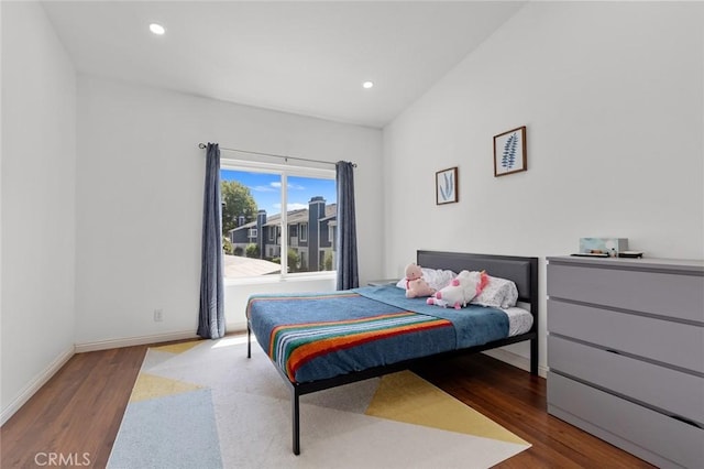 bedroom with wood finished floors, baseboards, and recessed lighting