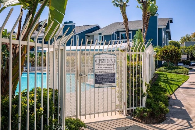 gate with a community pool and fence