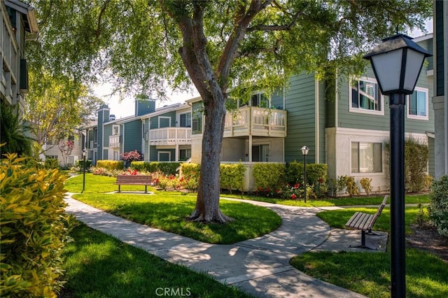 surrounding community with a yard